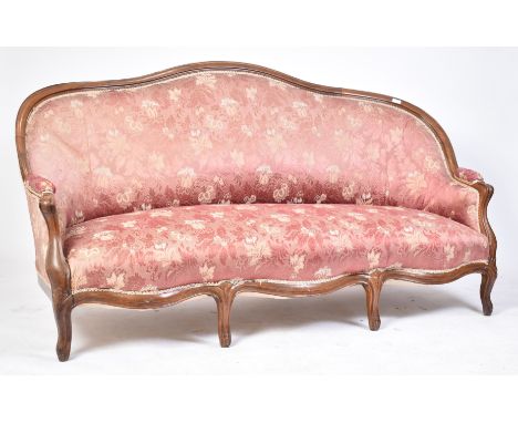 A 19th century Victorian rosewood canape sofa settee. The sofa of shaped serpentine / hump back form with carved decoration t