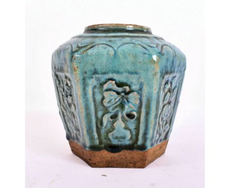 A late Qing Dynasty Chinese Oriental ceramic hexagonal Shiwan kiln ginger jar in green finish glaze. Floral decorations throu
