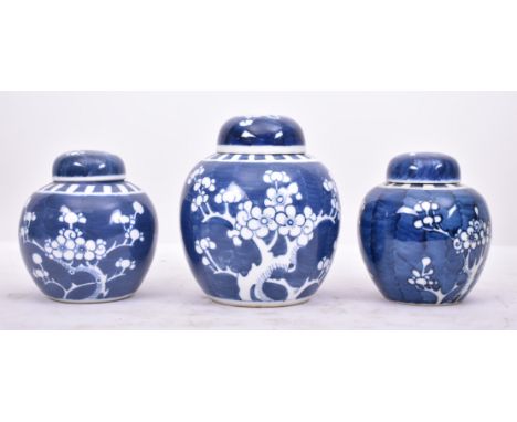 A set of three late 19th century Chinese Oriental blue &amp; white porcelain Prunus patter ginger jars. Each jar painted in t