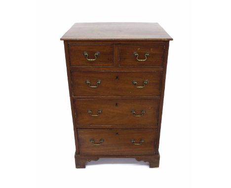 19th century mahogany chest of drawers of small proportion, the top drawer with a dummy short drawer front panel over three f