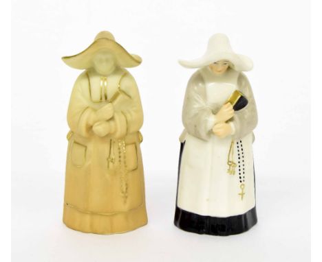 Two similar Royal Worcester porcelain candle snuffers modelled as nuns, one blush ivory and the other painted, puce factory m