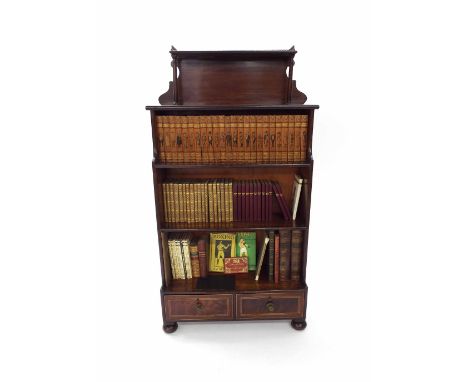 19th century mahogany open waterfall bookcase, the brass gallery open shelf over three tiers and two inlaid short drawers to 