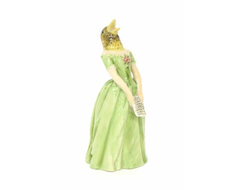 Royal Worcester porcelain candle snuffer of Jenny Lind, modelled wearing a long green dress with a bird's head, puce factory 