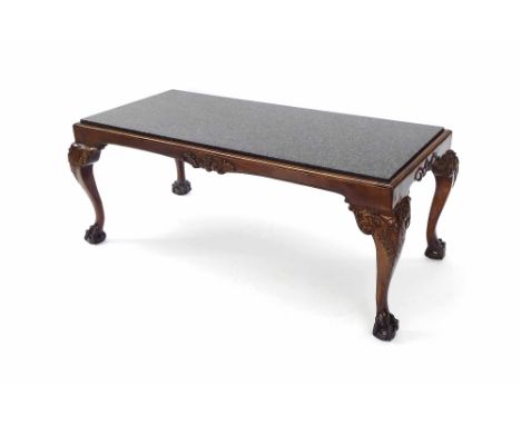 Marble top coffee table in the Chippendale manner, with carved ball and claw detailed feet, 45" x 22"