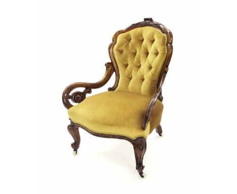 Attractive Victorian walnut framed upholstered armchair, the carved frame with open scroll hands, gold velvet coloured button