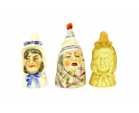 Three Royal Worcester porcelain candle snuffers depicting head studies, green and puce factory marks, the largest 3.25" high 