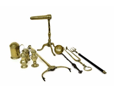 19th century brass goffering iron upon a tripod base, 10.5" high; four assorted antique brass sifters; together with four ass
