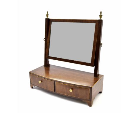 Small 19th century mahogany bow fronted toilet mirror fitted with two drawers and supported upon bracket feet, 16.25" wide