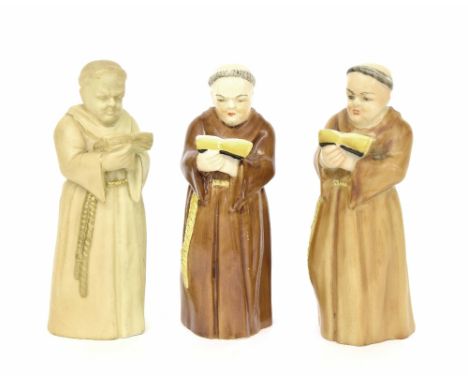Three similar Royal Worcester porcelain candle snuffers modelled as monks, each with puce factory marks, each 5" approx (3)