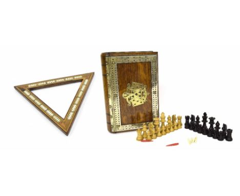 Oak games box in the form of a book bind, with applied metal mounts and inset cribbage, containing a chess set, 8.75" x 6"; a