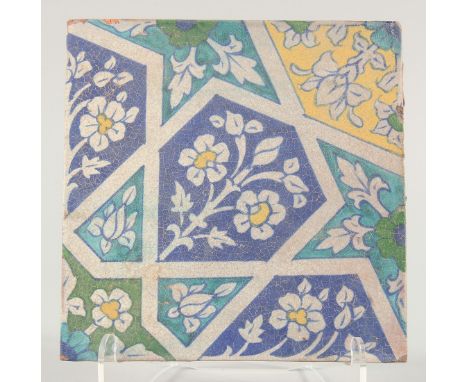 A 19TH CENTURY NORTH INDIAN MULTAN POTTERY TILE, 23cm square.