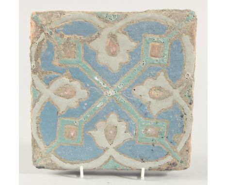 A PERSIAN SAFAVID CUERDA SECA POTTERY TILE, 20cm square.