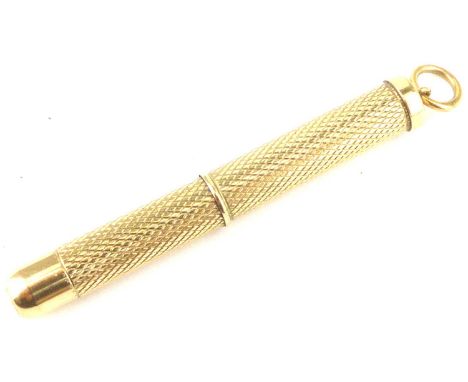 A 9ct gold chain mounted toothpick with twist action and engine turned body, length 5cm, approx. 5.7g (af, lacking pick).