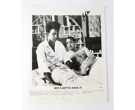 A black and white photograph advertising the film 'She's Gotta Have it', bearing the signatures of Spike Lee and Tracy Camill