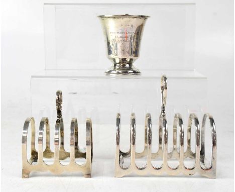 An Elizabeth II hallmarked silver six-division toast rack, Sheffield 1960, a further smaller four-division toast rack and a s