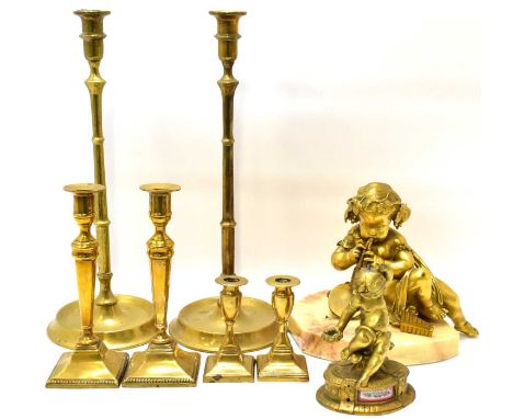 A large brass cherub playing panpipes and drum, with draped gown, on marble base, height approx. 24cm, a single brass cherub 