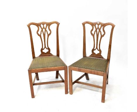 A set of six Chippendale-style mahogany dining chairs with drop-in seats and square stretchered supports (6).