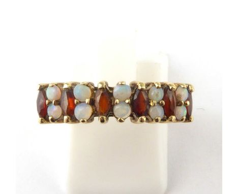 A 9ct gold opal and garnet half eternity ring with split shoulders, size O, approx. 2.2g.