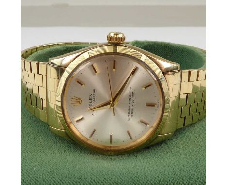 ROLEX; a gentlemen's 9ct gold Oyster Perpetual Superlative Chronometer officially certified, the silvered dial set with raise