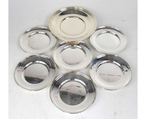 GORHAM; a set of six silver side plates, diameter 15.5cm, numbered '10', together with one similar larger plate, diameter 21c