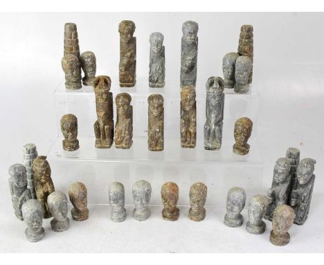 A 20th century carved soapstone chess set modelled as African figures and busts, height of largest 14cm.