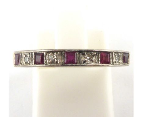 An 18ct gold diamond and ruby half eternity ring, size O, approx. 2.6g.