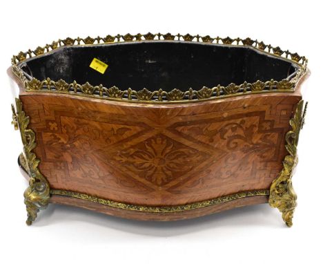 A 19th century French planter of lozenge shape with marquetry geometric panels and ormolu galleries top, handles, side mounts