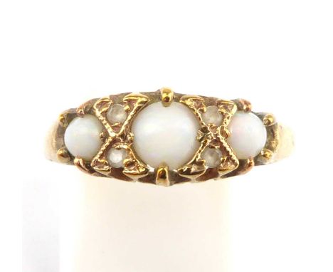 A 19th century 9ct gold ring set with three white opals, size P, approx. 2g.