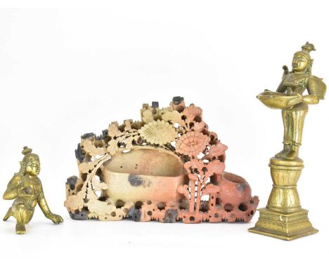 A Tibetan-style brass figure holding a ball, possibly an oil lamp, height 22.5cm, a kneeling Oriental figure, height 10cm and