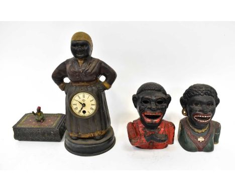 Two cast metal reproduction 'Jolly Gentlemen' money boxes, together with a metal figural clock in the form of a housemaid wit