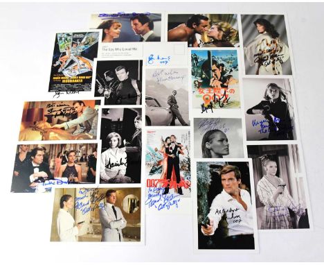 JAMES BOND; a group of promotional postcards bearing several signatures, including Diana Rigg, Roger Moore, Ursula Andress, e