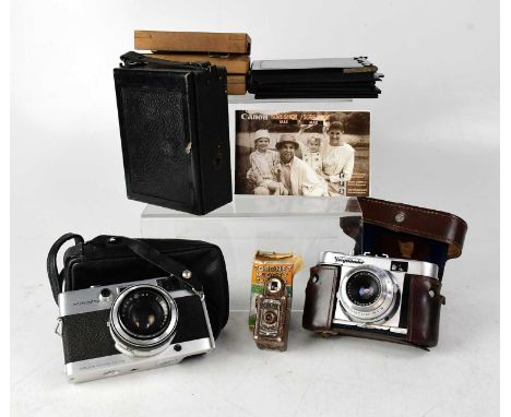 A Coronet 'Midget' camera (box af), a Voightlander camera, a Minolta camera, Box Brownie style camera and a small collection 