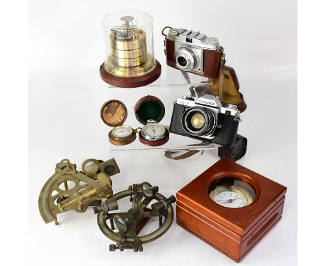 A group of scientific instruments including several modern examples, also a cased pocket barometer, a camera, etc.