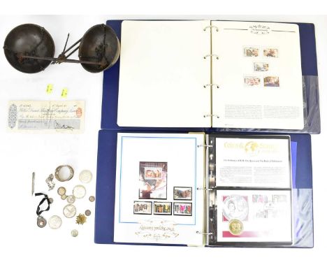 A collectors' lot to include two 'The Royal Family' stamp folders, various Canadian dollars, small coins, a silver fob, napki