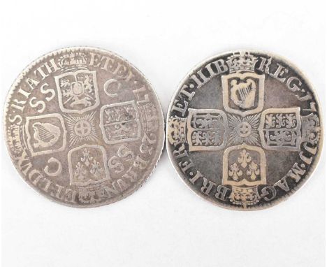 Two silver shillings comprising Anne 1711, fourth bust plain and a George I 1723, first bust, no bow, SSC in angles (2).Condi