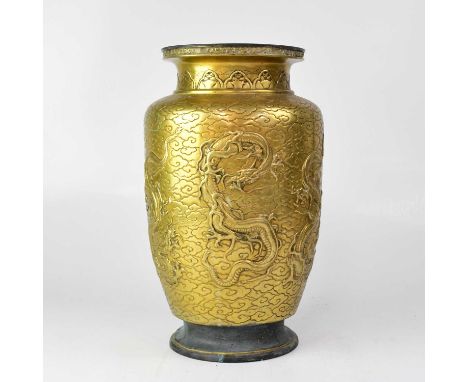 A large Chinese designed brass vase, relief decorated with dragons and bearing character seal mark to base, height 39cm.Condi