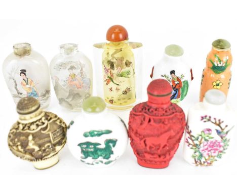 Nine various 20th century snuff bottles to include glass, porcelain, red lacquer etc, two ceramic examples have marks to the 