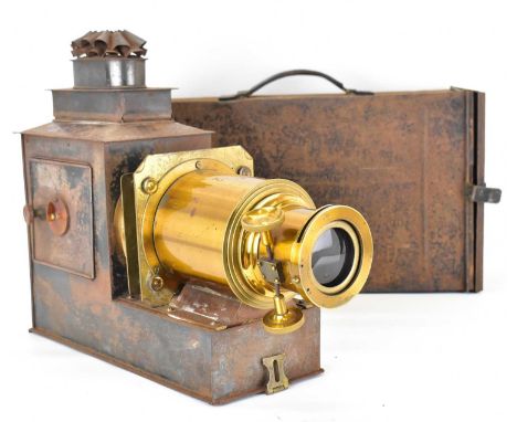 A 19th century tinplate magic lantern with lens, later converted to lightbulb.