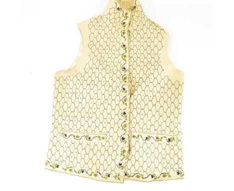 A late 18th/early 19th century cream-coloured silk and other floral waistcoat, with embroidered pocket button track and lower