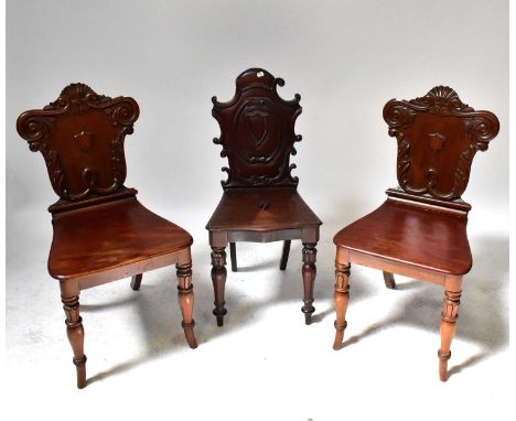 Two matching Victorian mahogany shield back hall chairs and a similar example (one af) (3).Condition Report: Single chair, pi