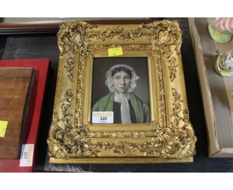 A gilt framed portrait print of a lady