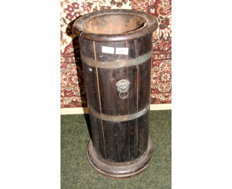 A brass-bound and mounted oak stick stand with tin liner 