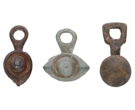 Celtic, bronze toggles (3), 1st century AD, comprising boss and petal with blue enamel in the centre; single boss; double pet