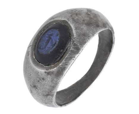 Romano-British, late 2nd-3rd century silver ring, 5.73g, 2.3cm wide by 2cm deep; set with a blue glass intaglio imitating nic