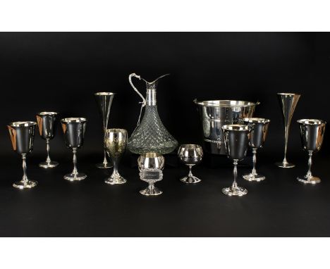 A Cut Glass and Plated Ship's Decanter of typical form with scrolling etched handle detail. Together with 11 assorted plated 