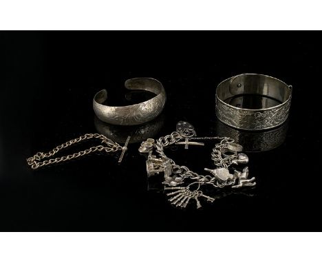 A Collection Of Silver Jewellery Items Total weight, approx 78.5 grams. To include Anglo Indian etched cuff, charm bracelet w
