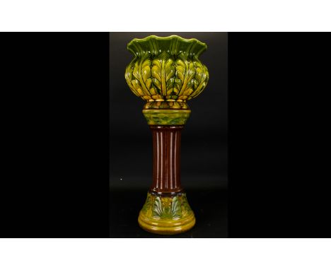 A Bretby Majolica Jardiniere Art nouveau foliate design jardiniere in green and cartreuse glaze, impressed mark to base ,1106