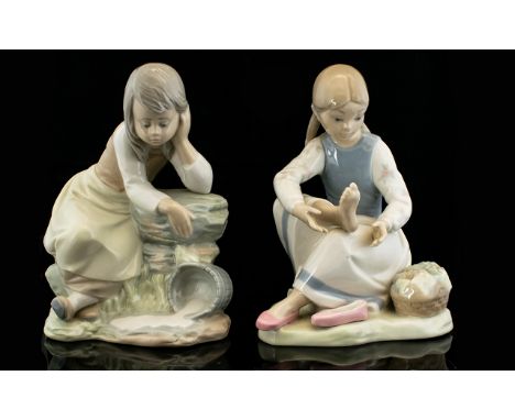 Nao by Lladro Porcelain Figures ( 2 ) In Total. Comprises 1/ Young Lady Looking Thoughtful, Over a Bucket of Spilled Milk. He