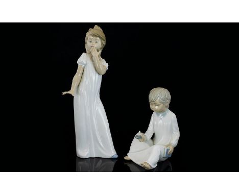 Nao by Lladro Pair of Porcelain Figures - Depict Young Boy and Girl In Nightdresses, The Boy with Candle and Book. Girl Figur