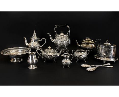 A Large Collection of Late 19th/Early 20thC Plated Items 12 pieces in total. To include ornate embossed spirit kettle, footed